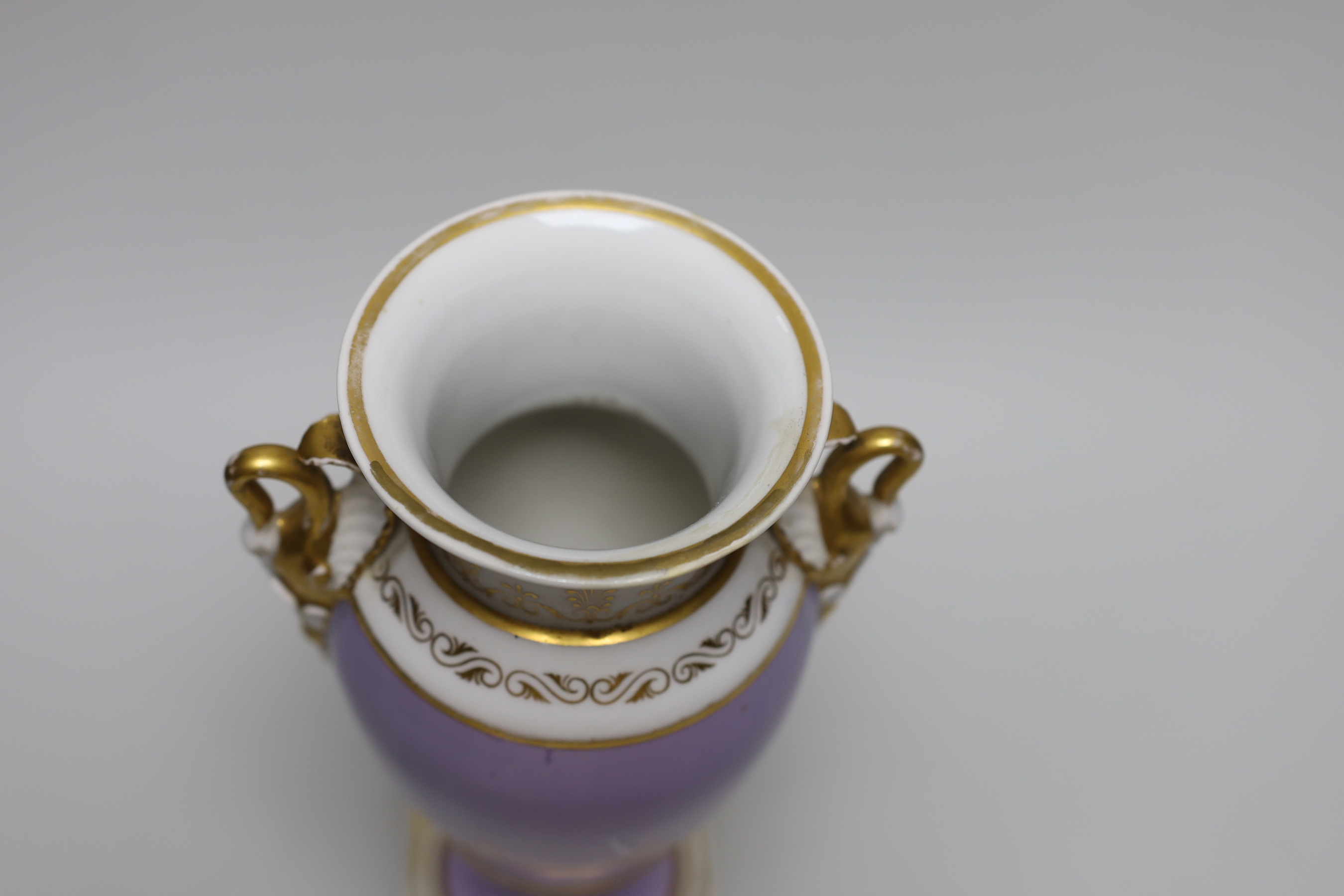 An English porcelain vase with swan handles, probably Chamberlains Worcester, painted with flowers on a lavender ground c.1820, 25.5cm tall